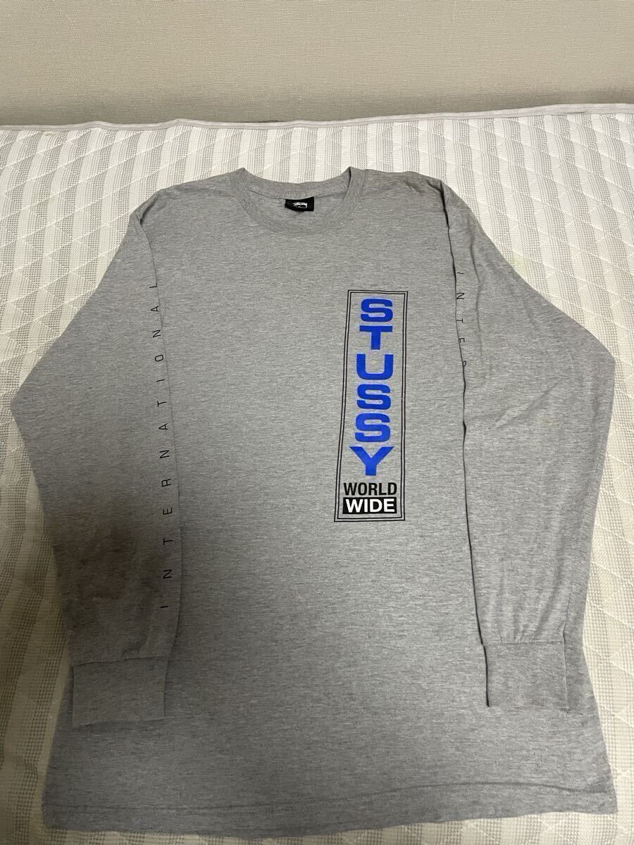 美品 灰 STUSSY ステューシー ロンT 長袖Tシャツ Tシャツ カットソー アウター ジャケット パーカー シャツ S M L 筆記体 ロゴ 長袖 黒 拍卖