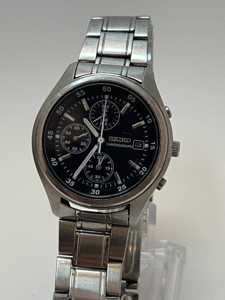 動作未確認 SEIKO セイコー 7T92-0CC0 シルバー クォーツ 3針 デイト ラウンド 黒文字盤 メンズ 防水 クロノグラフ拍卖