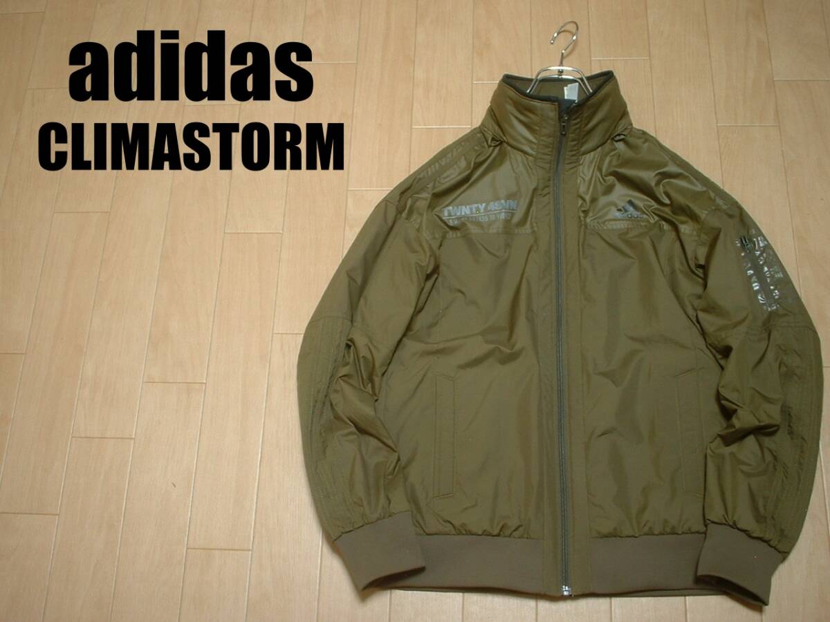 adidas大人気クライマストームトラックジャケットLカーキ正規TWNTY4SVNアディダスCLIMASTORMスリーストライプスナイロンジャージトップ拍卖