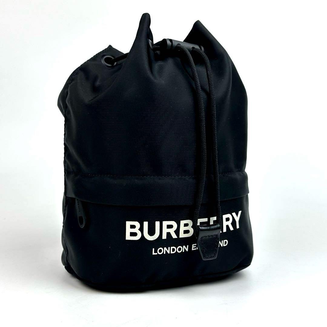 未使用●保管品●BURBERRY バーバリー 巾着 ドローコード ポーチ ロゴ ハンドバッグ ナイロン 黒色 ブラック フォーマル 男女兼用 現行品拍卖