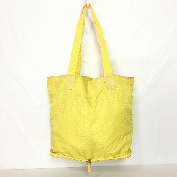 ダナキャランニューヨーク DKNY トート 折り畳み式バッグ 黄色 ロゴ総柄 持ち手長め 管NO.B8-7拍卖