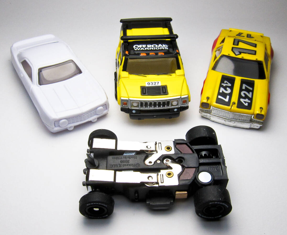 HOスロットカー 新品!AW 2005 ハマー H2 & マグナカータイプウルトラGシャシー 1台 & 2ボディー トミー AFX や TYCO のコースでも走る!拍卖