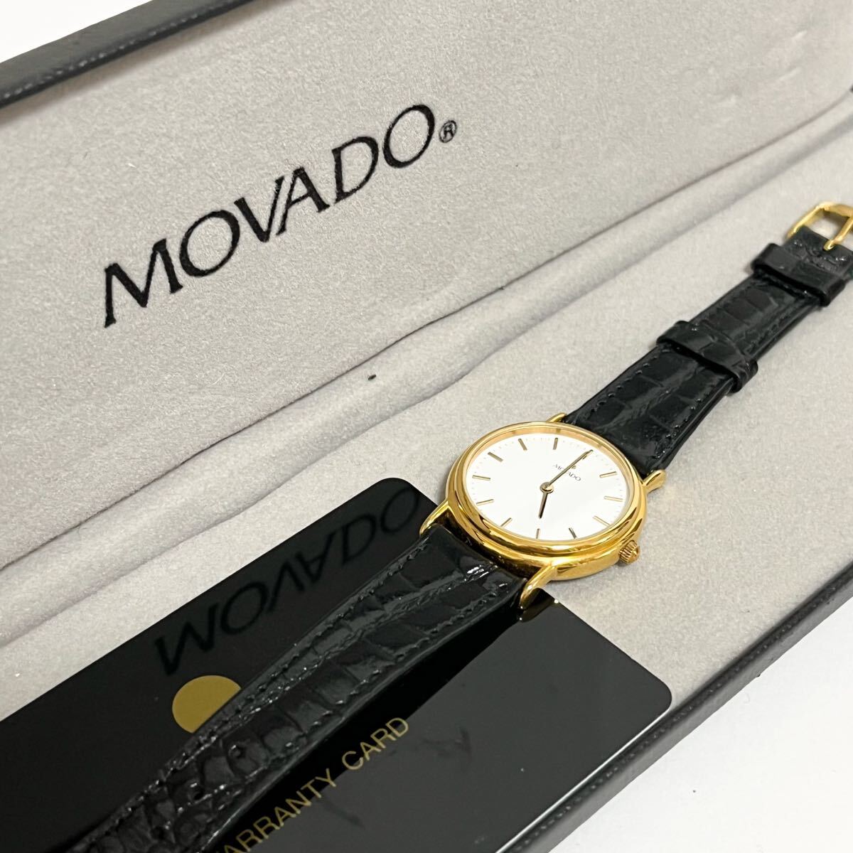 和851★ 箱付き MOVADO モバード クォーツ 腕時計 ウォッチ 2針 87.27.822 1144171 ホワイト ゴールド レザーバンド レディース拍卖