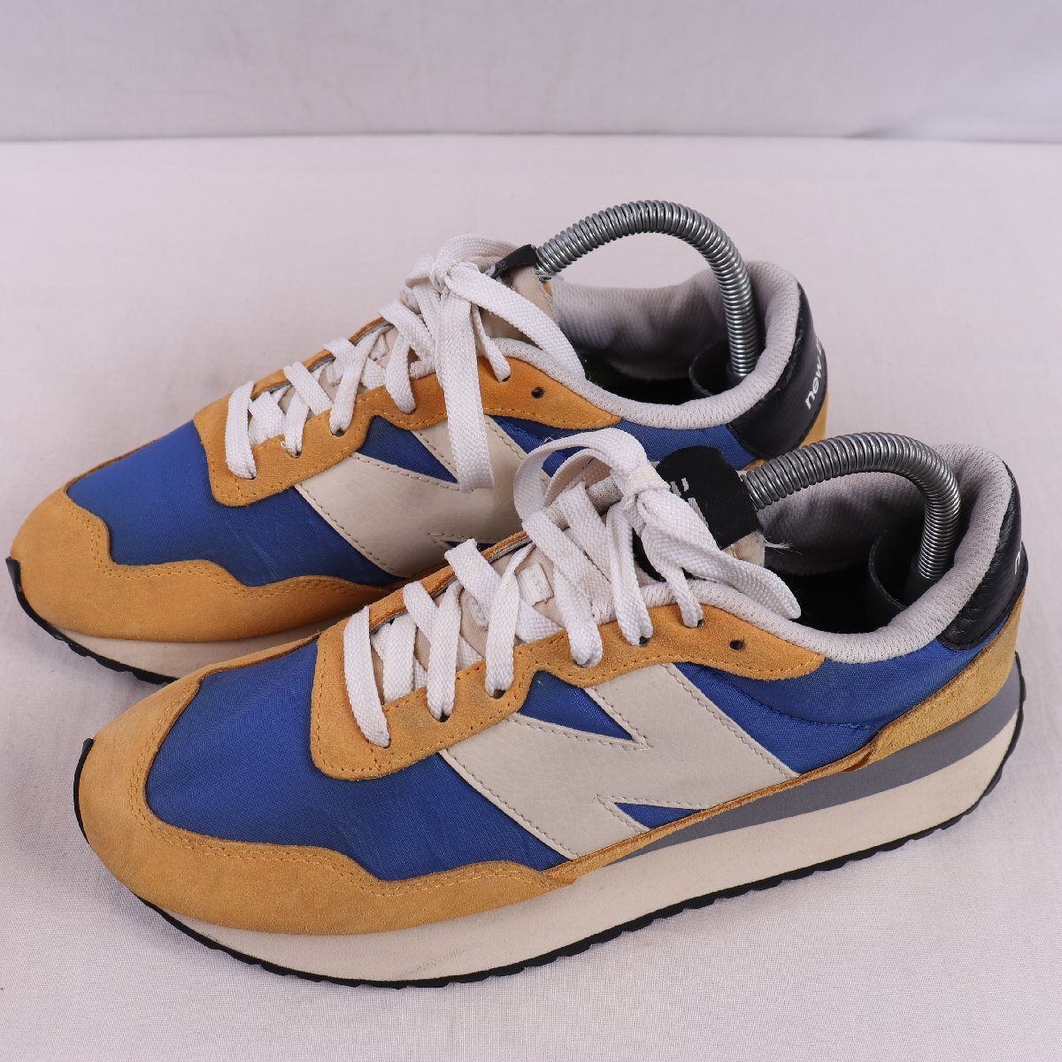 237 ニューバランス 25.0cm/new balance 青 ブルー 黄色 イエロー オフホワイト 黒 ブラック 中古 古着 スニーカー メンズ yy7058拍卖