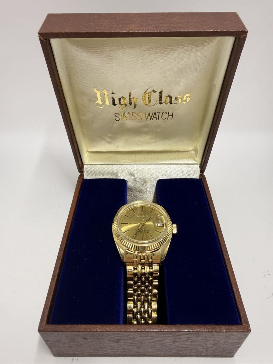 O)【不動品】 LIGUN DELUXE リジンデラックス メンズクオーツ 腕時計 箱付き ゴールドカラー拍卖