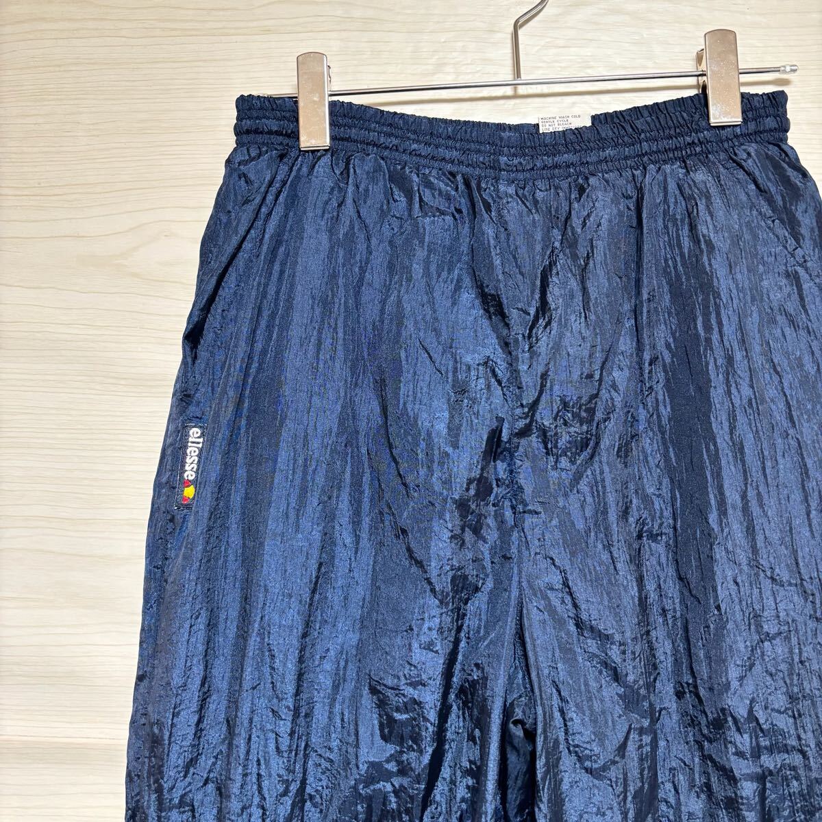 ellesse エレッセ ナイロンパンツ シャカパン イージーパンツ ウエストゴム サイズL相当 ネイビー 紺 ポリエステル メンズ ボトムス (34)拍卖