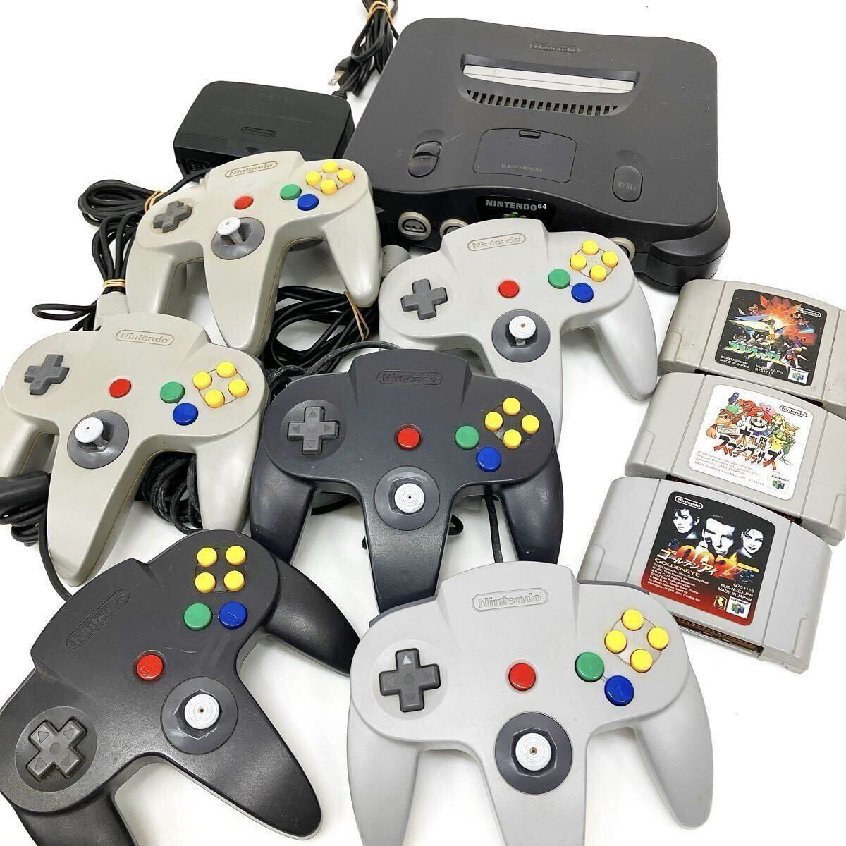 任天堂 ニンテンドー 64 NUS-001 本体 ブラック コントローラー 6点 カセット 3点 まとめて 通電確認済 arc依頼星1010拍卖