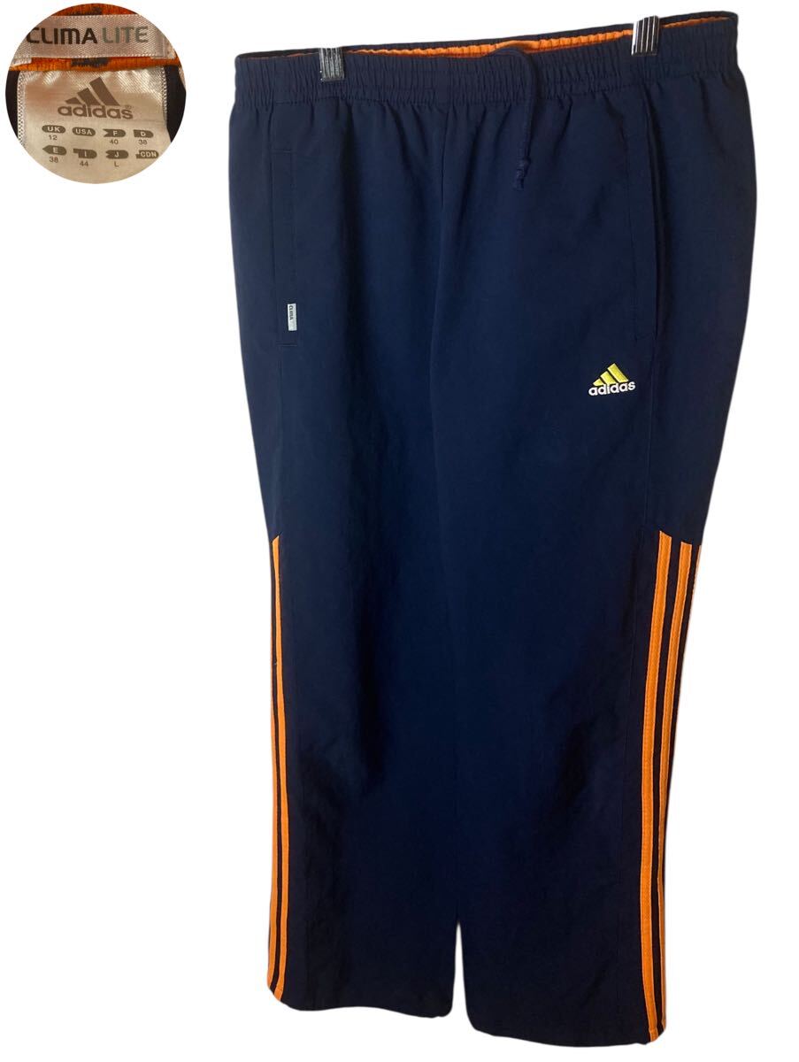 グッドデザイン古着adidasナイロンジャージトラックパンツ ネイビー×オレンジ拍卖