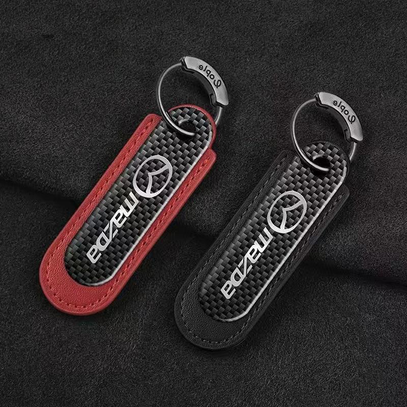 マツダ カーボンキーホルダー 本革レザー 車のキーチェーン 車のキータグペンダント 高級 キーリング 外せるリング ブラック/レッド拍卖