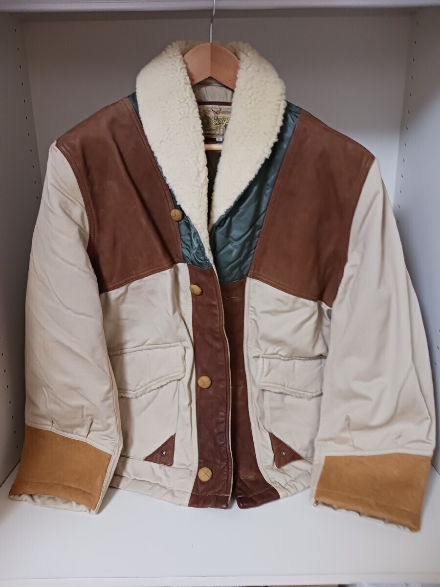 シェビニオンCHEVIGNON ジャケット。サイズ表示M。着丈70cm身幅65cm裾幅52cm。レザー、ボア。1996年頃購入、試着のみの美品。ビンテージ拍卖