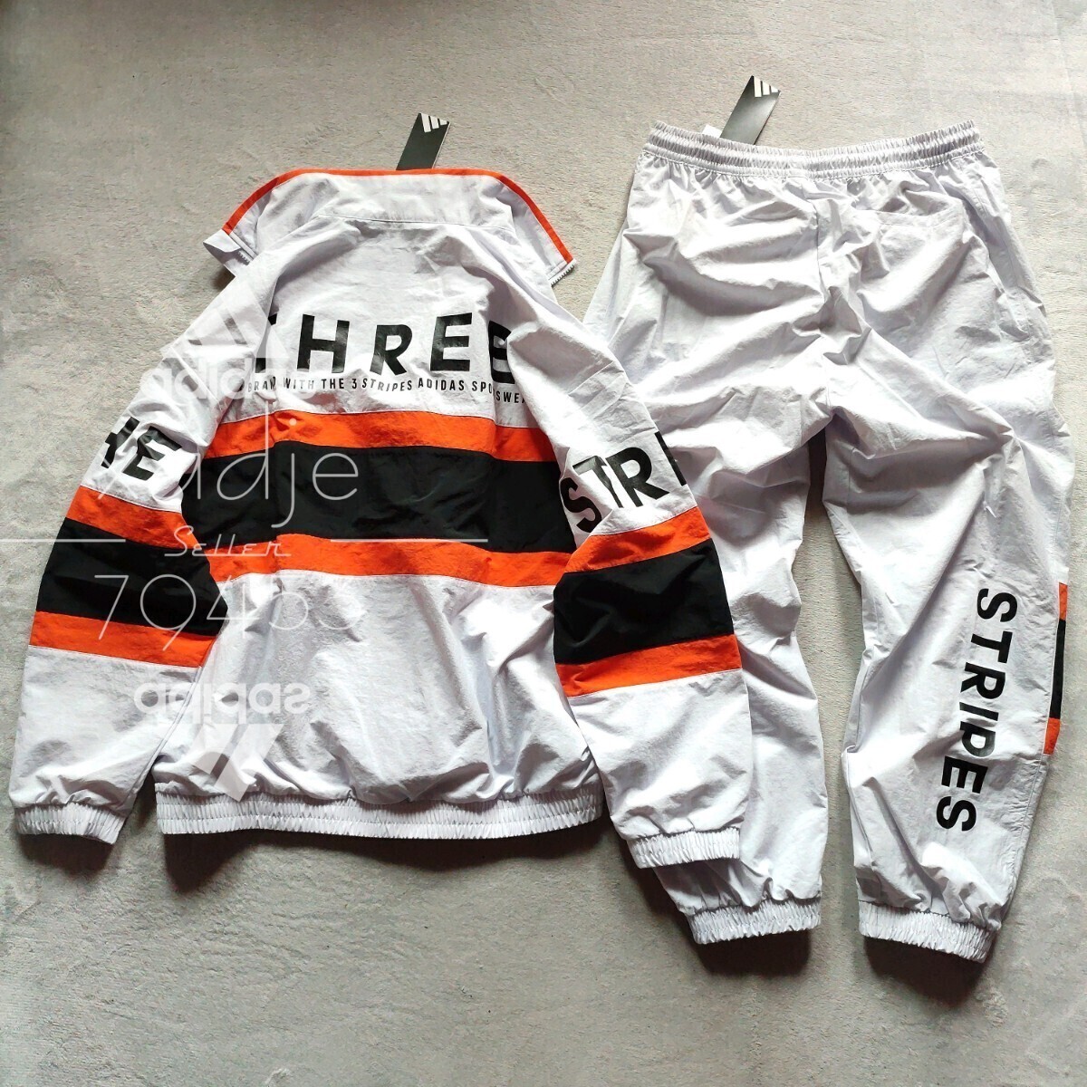 新品 正規品 adidas アディダス 上下セット ナイロン セットアップ 裏地メッシュ付き 薄手 グレー オレンジ 黒 定価18040円 ゆるめ M拍卖