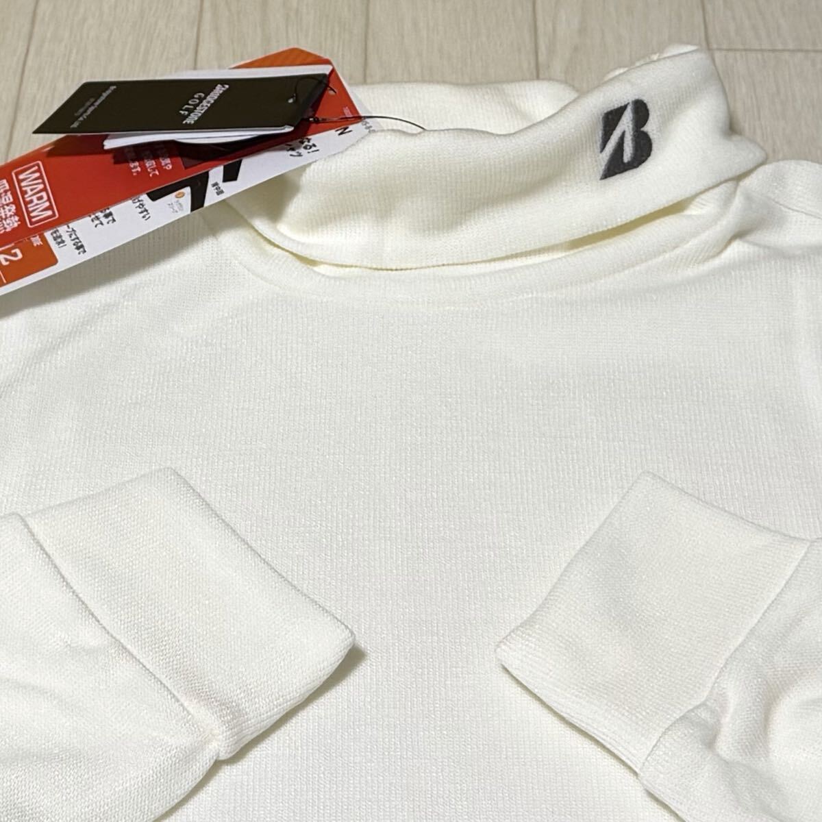 新品★ブリヂストン ゴルフ BRIDGESTONE GOLF 起毛スムース生地 WARM 吸湿発熱 長袖タートルネックシャツ/日本製/オフホワイト/サイズLL拍卖
