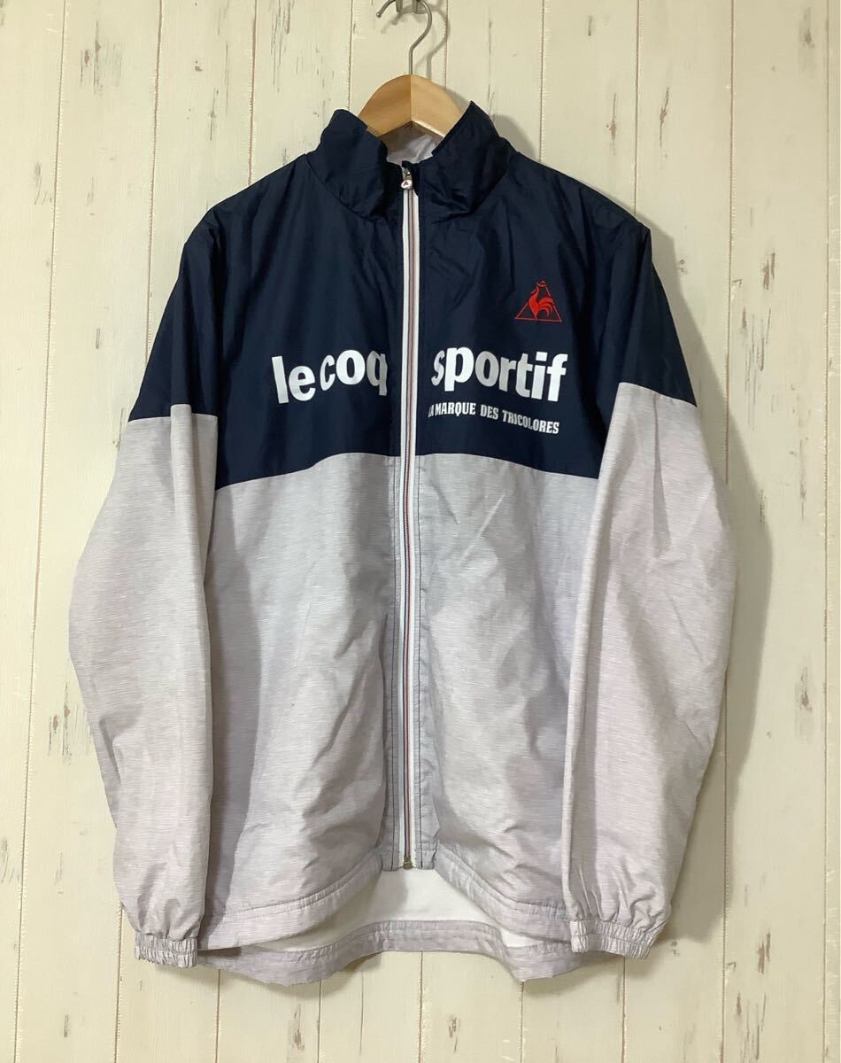 て1759 le coq sportif ルコック ウインドブレーカー ウインドジャケット バイカラー M グレー/ネイビー ロゴ刺繍 裏トリコット拍卖