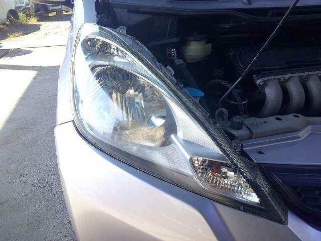 フィット DBA-GE6 右ヘッドランプ/ヘッドライト 純正 ハロゲン レベライザー付 スタンレイ P9603拍卖