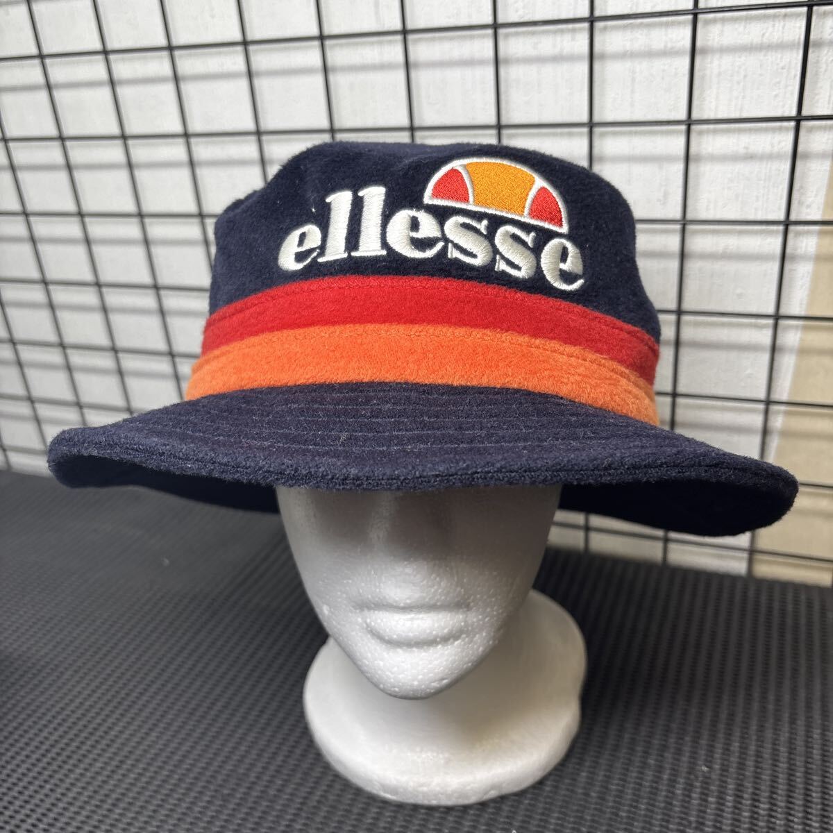 ★大阪/店舗受け取り可★ellesse エレッセ バケットハット ネイビー オレンジ レッド ロゴ刺繍 帽子 59cm ユニセックス アウトドア★拍卖