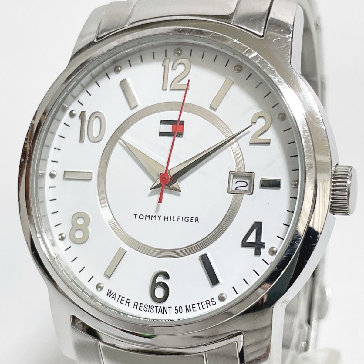 稼働品 TOMMY HILFIGER トミー ヒルフィガー T10156 デイト 白文字盤 シルバー系 QZ クォーツ メンズ腕時計 新品電池交換済み拍卖