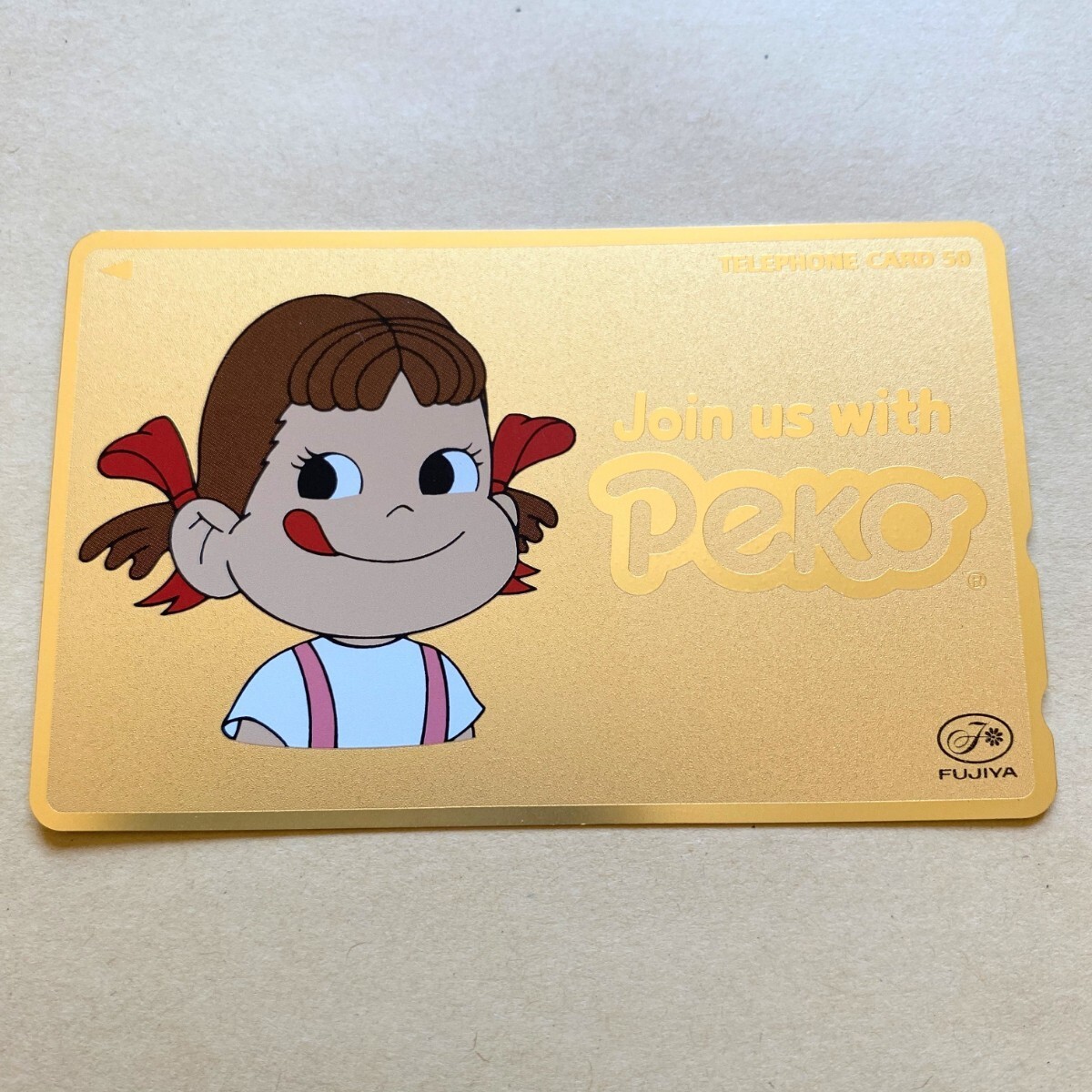 【未使用】 テレカ 50度 ペコちゃん Join us with Peko ゴールド 不二家拍卖