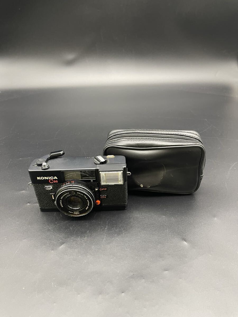 春名 3月 NO.164 KONICA コニカ コンパクトフィルムカメラ ブラック C35 汚れ傷錆あり 38mm 通電動作確認済 フラッシュ、音確認済拍卖