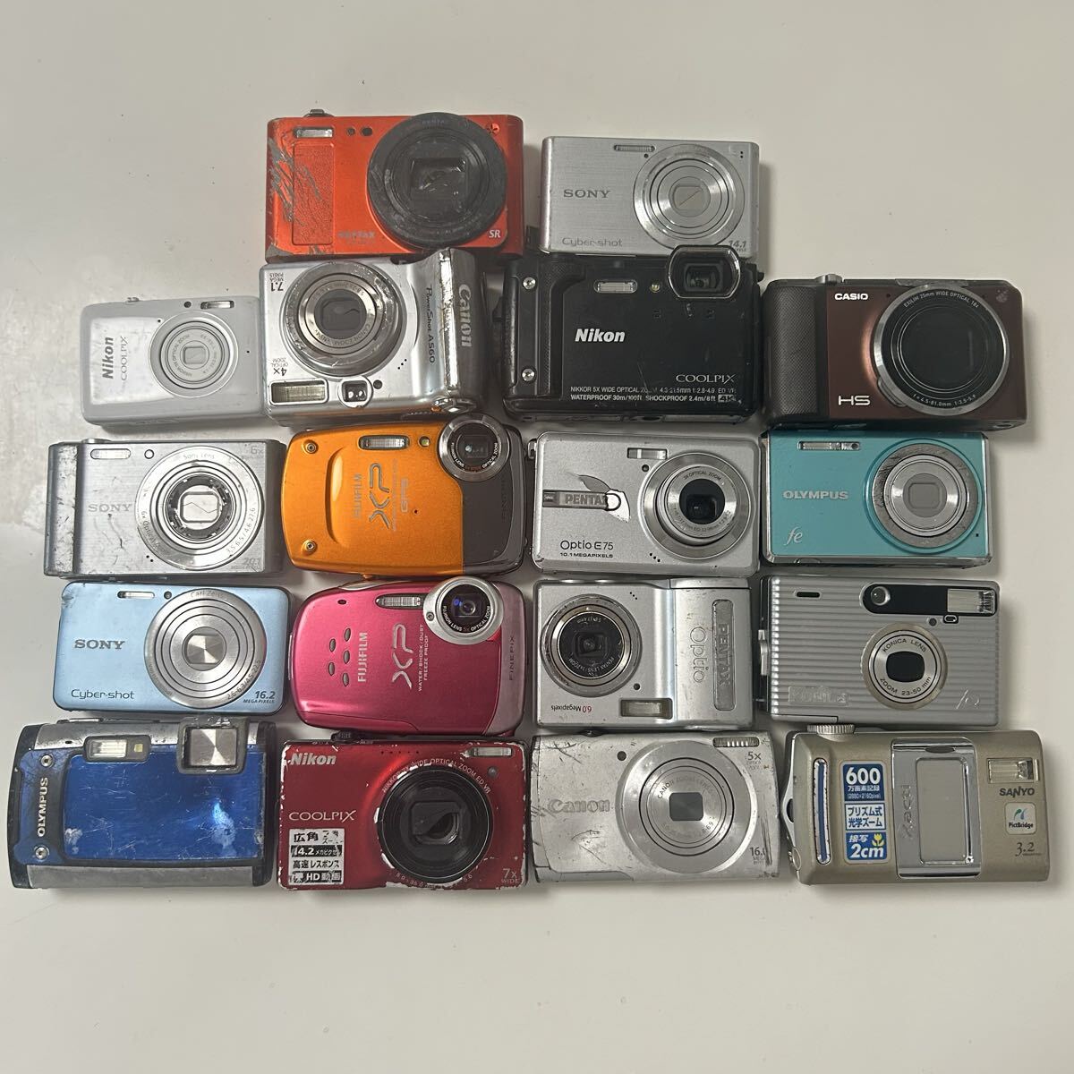 デジタルカメラ 18台まとめ売り Nikon Canon SONY CASIO PENTAX OLYMPUS FUJIFILM KONICA SANYO ジャンク 動作未確認拍卖