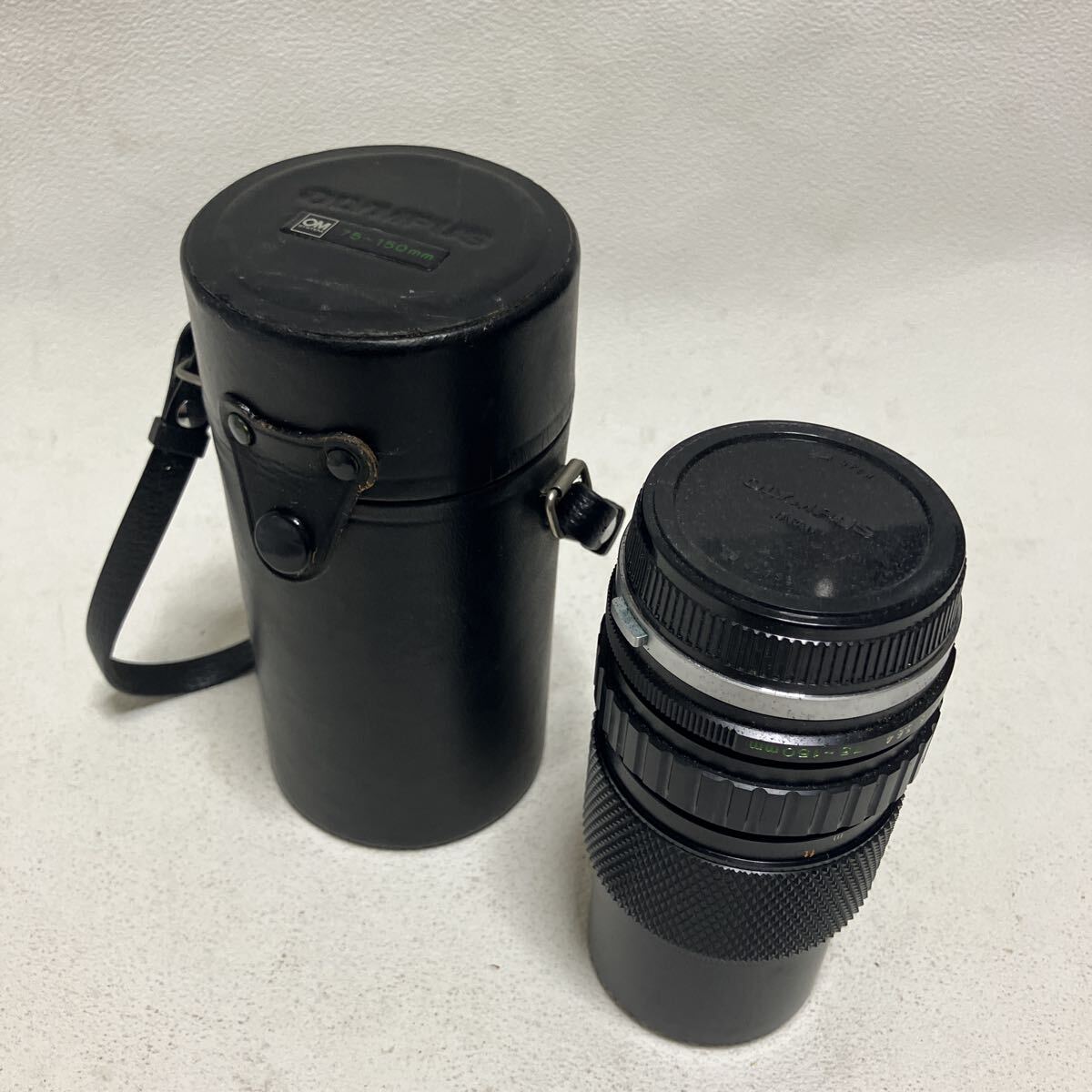 c1055 60 OLYMPUS オリンパス カメラレンズ 75〜150㎜ 革ケース付き レトロ 動作未確認 長期保管品 JAPAN LENS 拍卖