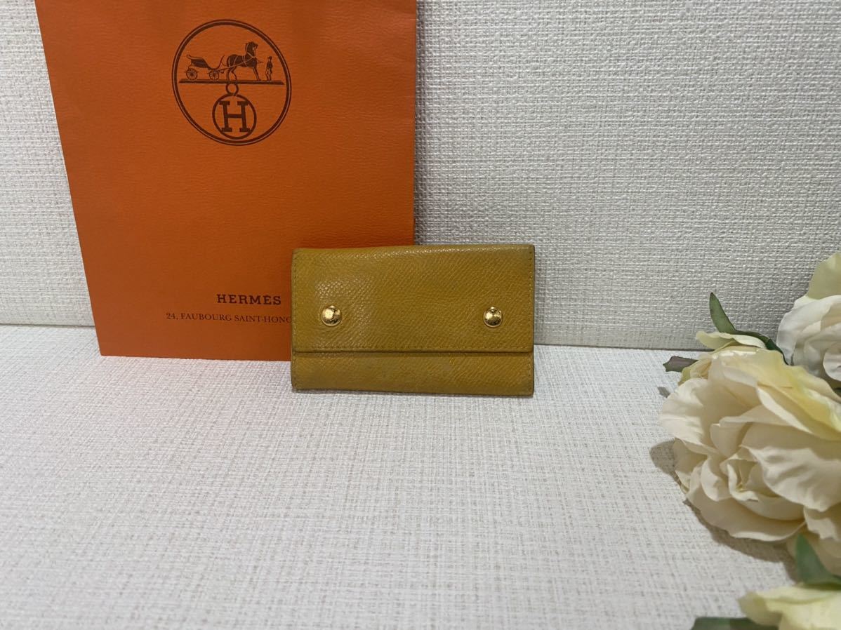 シンプルでおしゃれ♪HERMESエルメス本革レザーキーケース黄色イエローゴールドセリエボタン4連フック刻印ありキーホルダー拍卖