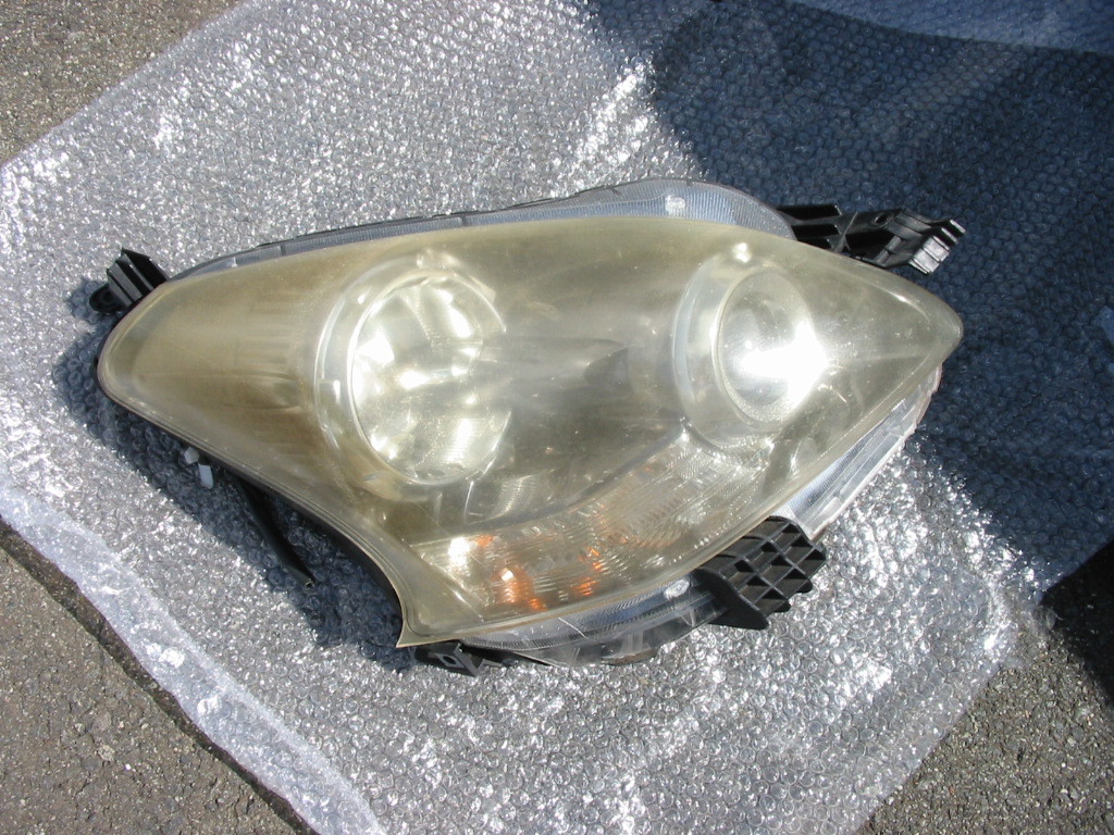 ジャンク品 ラクティス SCP100 右ヘッドライト 取り付け部割れ有 キズ有 ヘッドライト全面茶色 ICHIKOH 52-190 ハーネス ランプ拍卖