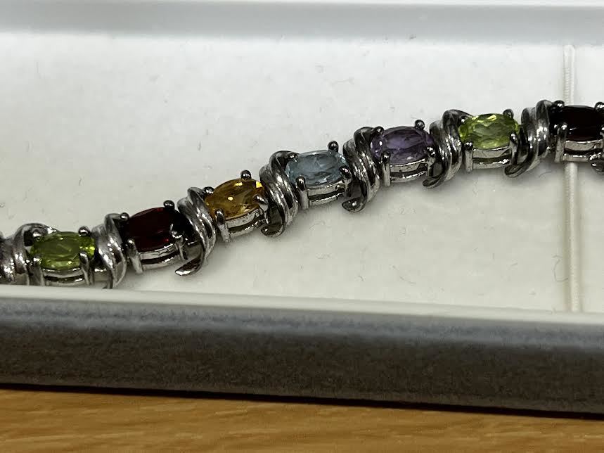 33 イエローとブルーのトパーズをあしらったブレスレット。 シルバー925。美品、重さ19.3拍卖