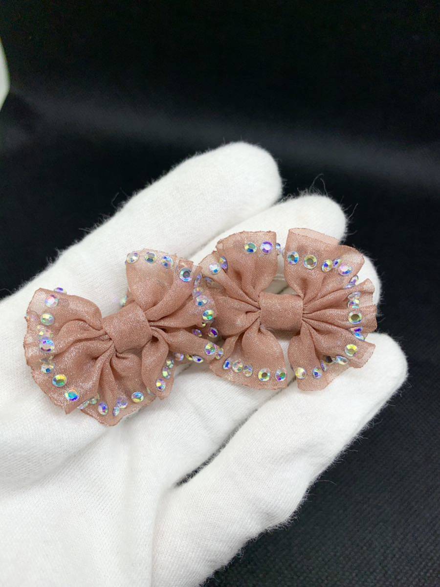 可愛いリボンラインストーンつきピンク色ピアス拍卖