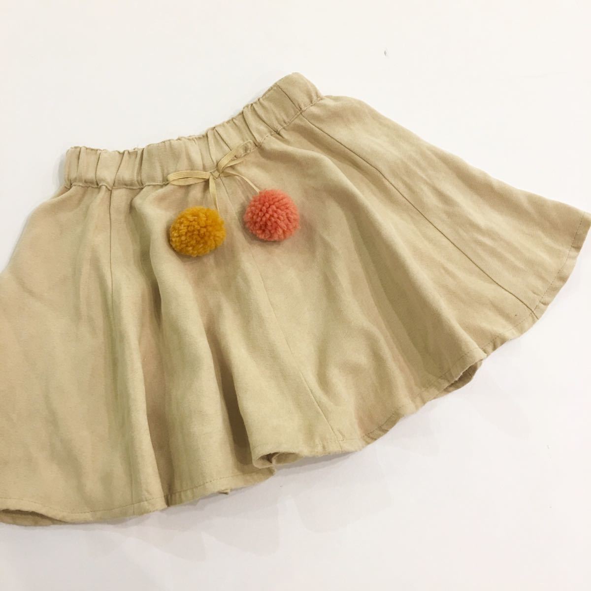 【新品未使用】Seraph セラフ スカート ピーチスキン リボン ポンポン ベージュ キッズ 100cm アイボリー ミニスカート拍卖