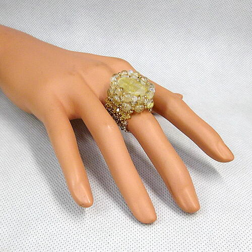 送料無料!ルチルクォーツとスワロフスキビースの編み込みリング!拍卖