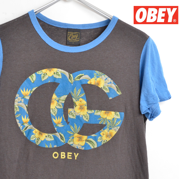 ST1570 オベイ OBEY Tシャツ 女性 S 肩37 プロパガンダ メールxq拍卖