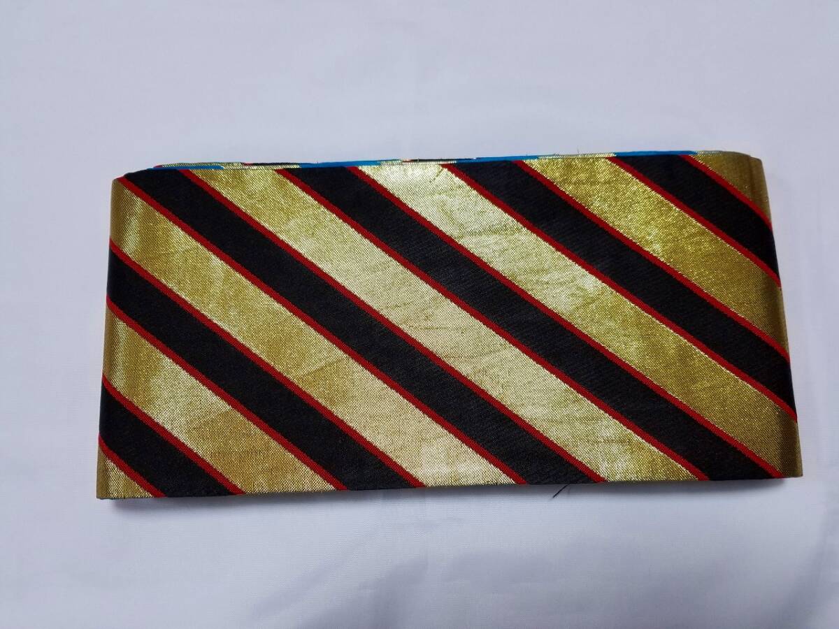 【桐徳】半幅帯☆両面織*8%値下げ☆美品{化繊地*袋.半幅帯}*表-黒*臙脂*金箔のナナメ線**裏-明るい青*金箔のナナメ線*№6490拍卖