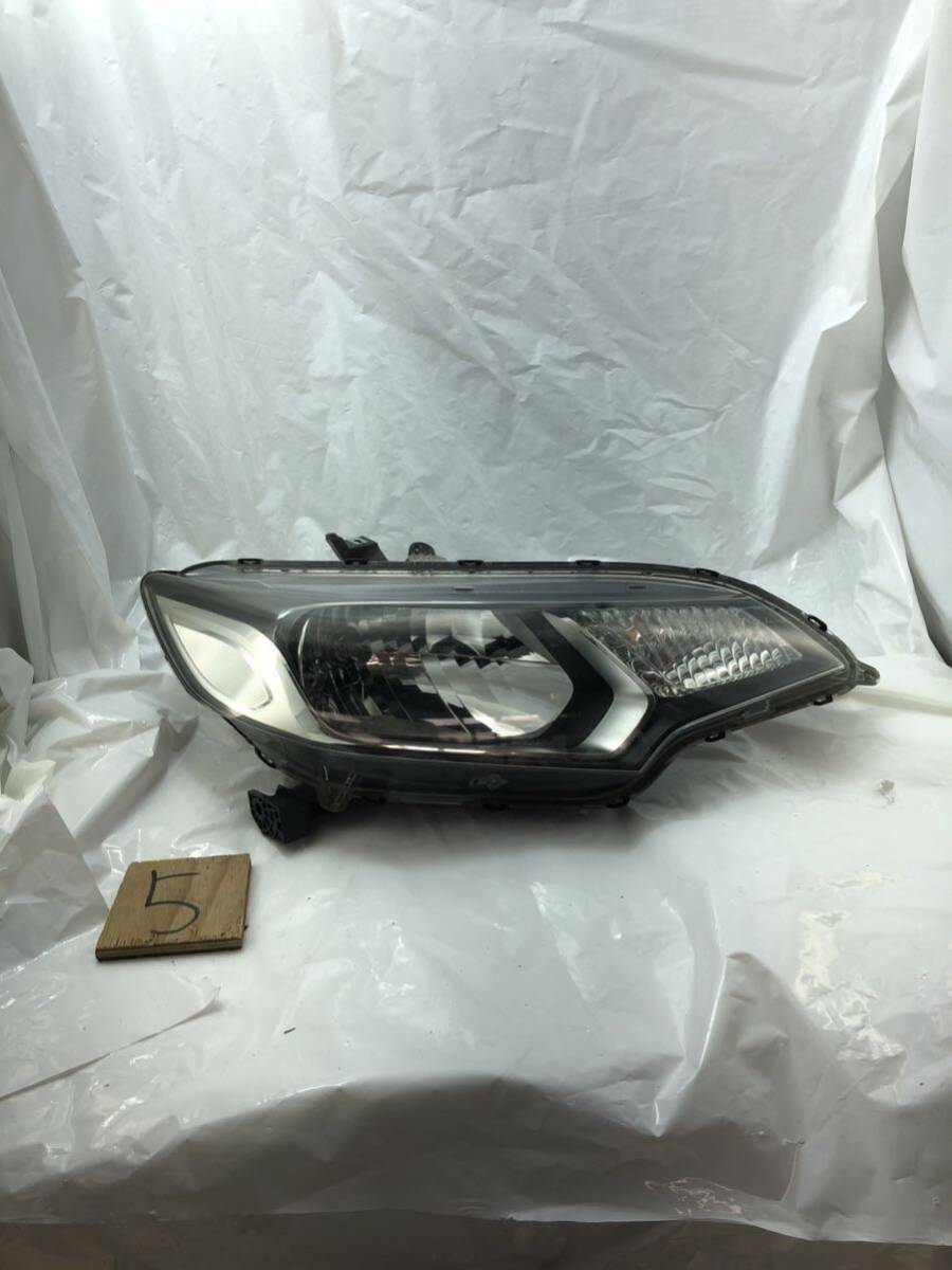 h5.68 フィット GP5 GP6 右ヘッドライト 右ヘッドランプ STANLEY W0349 右側運転席側 レベライザー拍卖