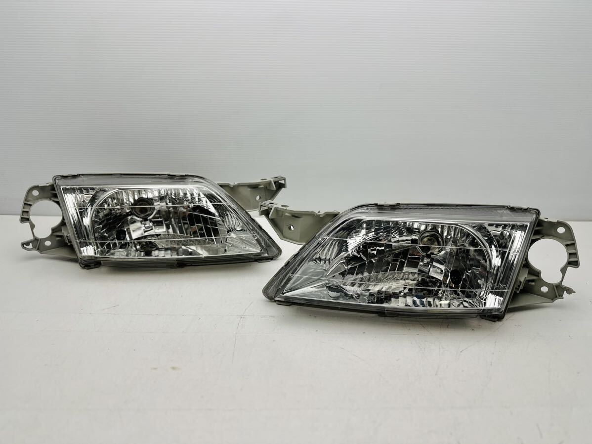 マツダ プレマシー CP8W 純正 左右セット ヘッドライト STANLEY P0286 ハロゲン ヘッドランプ (X151)拍卖