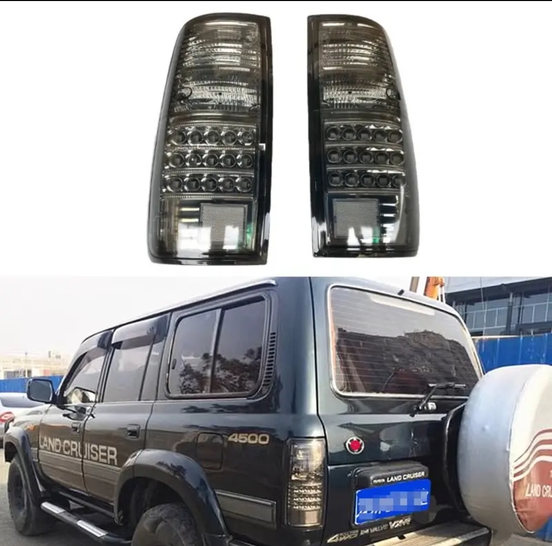 ④【新品未使用】トヨタ ランドクルーザー80系 テールライト リアブレーキランプ スモークレンズブラックフェイス 1991-1997拍卖