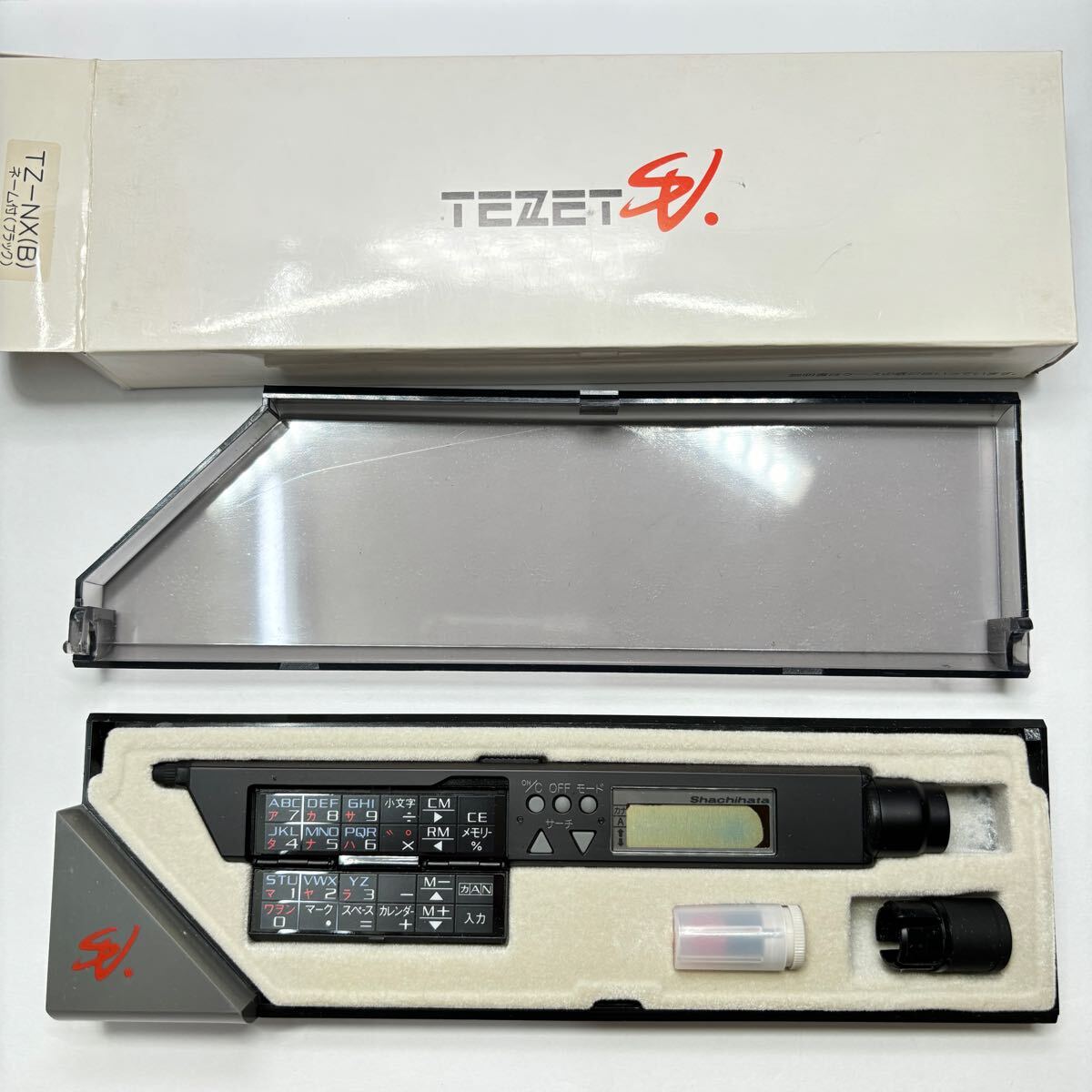 【新品未使用】【廃番】【希少品】文具店在庫品 TEZET シャチハタ テゼット 計算機付き 箱取扱説明書付き 昭和レトロ 電源入りません z0171拍卖