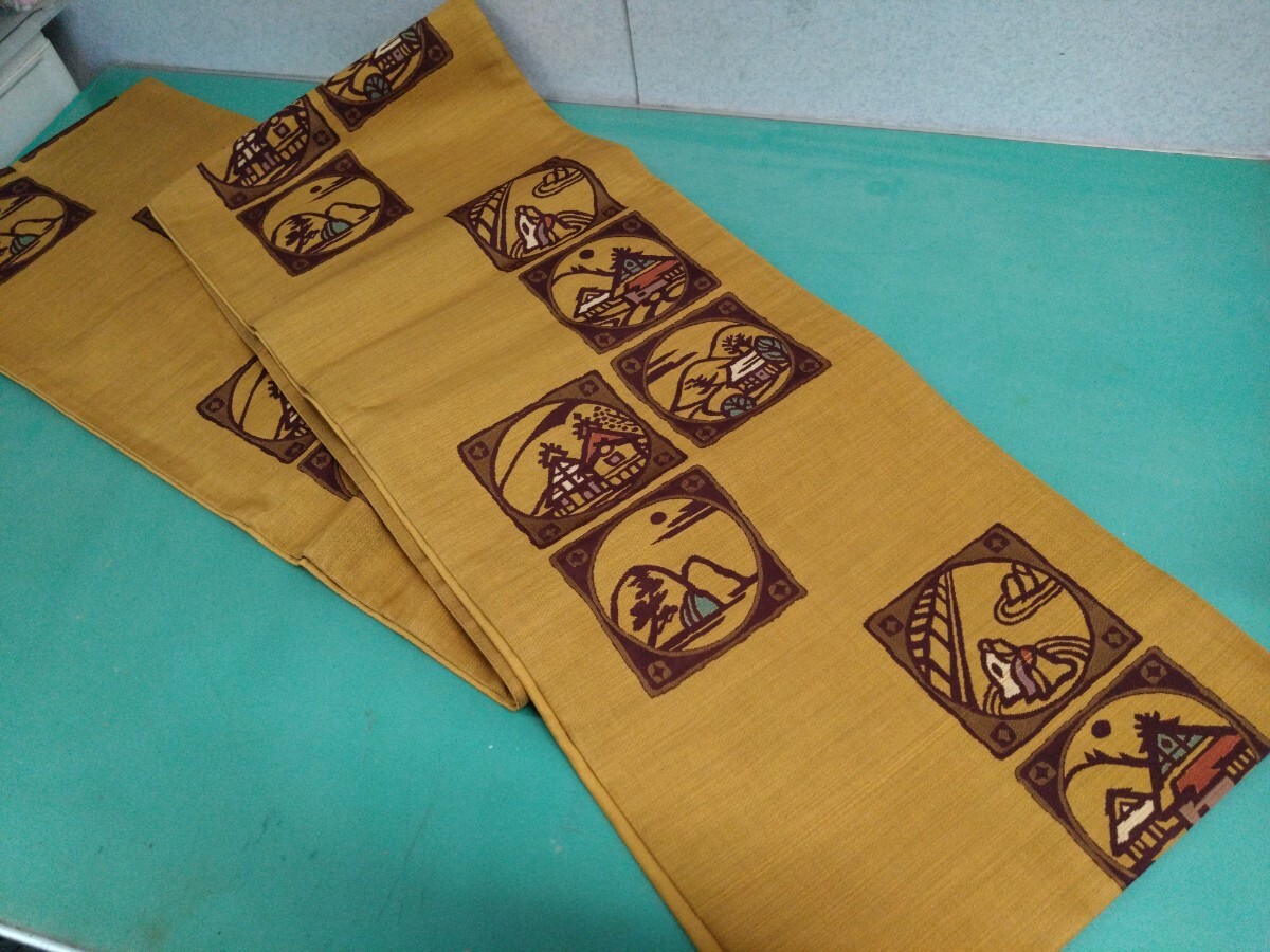 ●139 京都 西陣織 高級 袋帯 希少【にんな織物】謹製 切り絵 古民家 情景 紋様 辛子色 ハイカラ 可愛い お茶目 粋 六通 お太鼓 帯 中古 ③拍卖