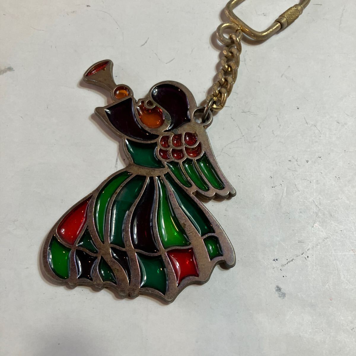 キーホルダー 美品 笛吹き 金属の枠にガラスを流し込んである 拍卖