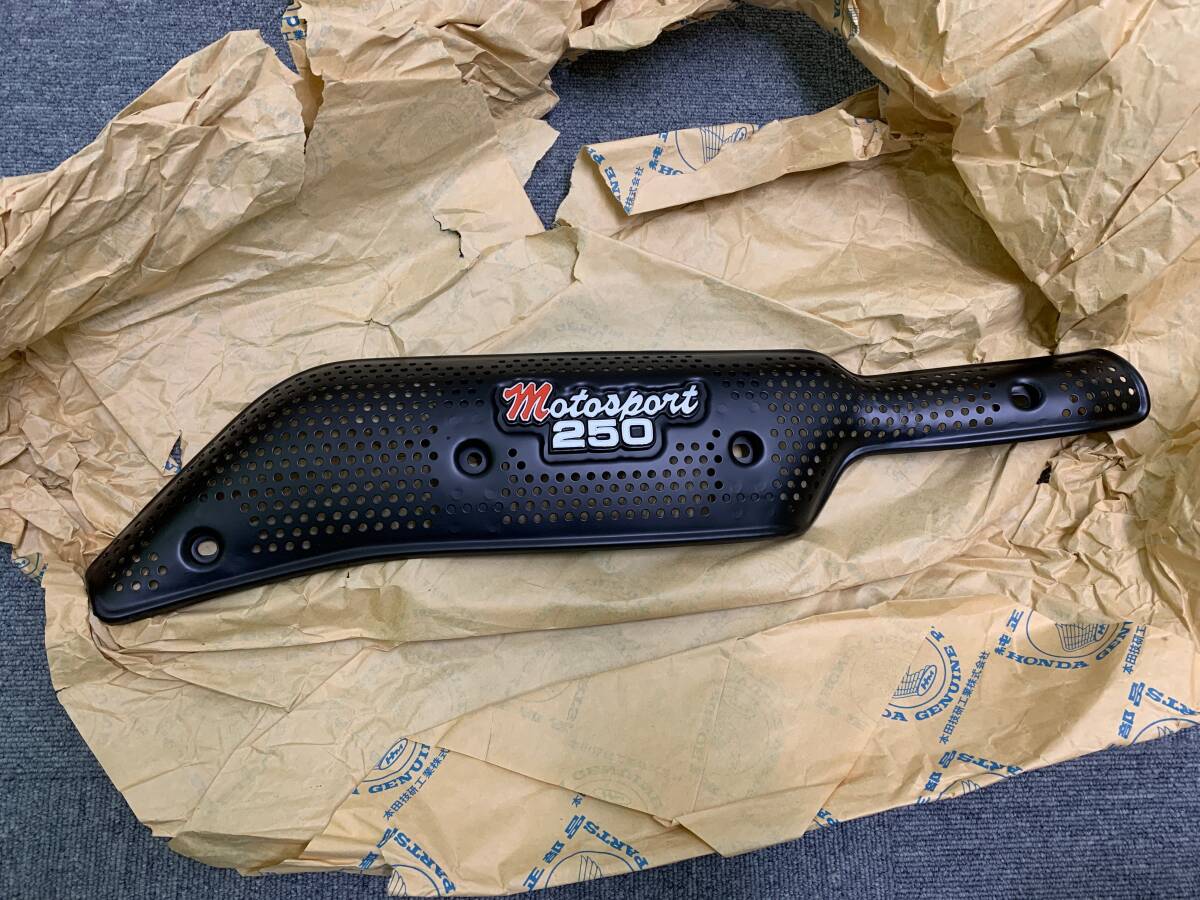 新品：SL250S純正マフラーカバー+エンブレム（リプロ）+取付パーツ付き