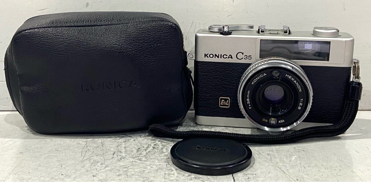250410E☆ KONICA C35 E&L LENS KONICA HEXNON 1:2.8 f=38mm レンズキャップ、ケース付 ♪配送方法＝おてがる配送宅急便(EAZY)♪