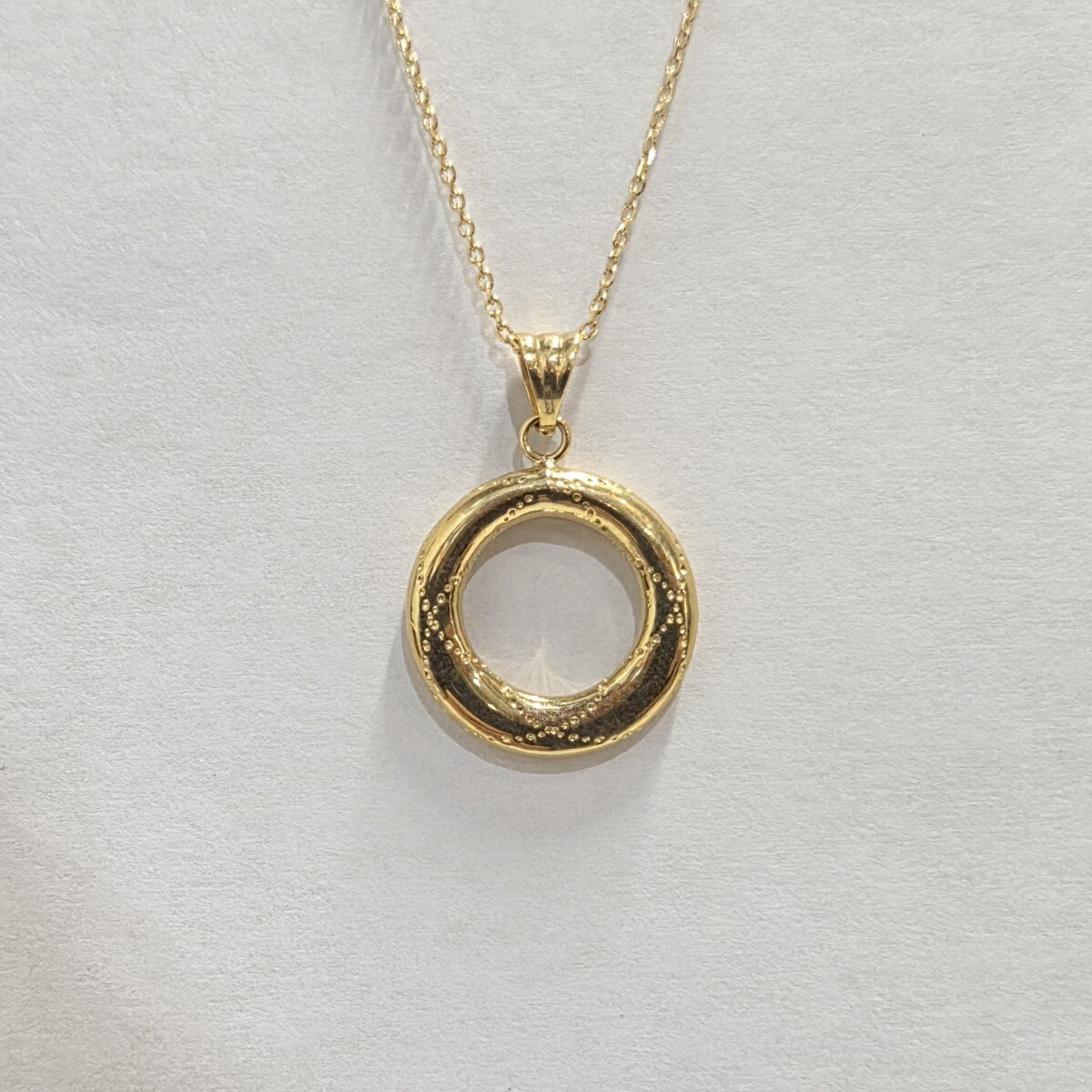 新品　UNOAERRE　イタリア製　K18　 サークルデザインペンダントトップ