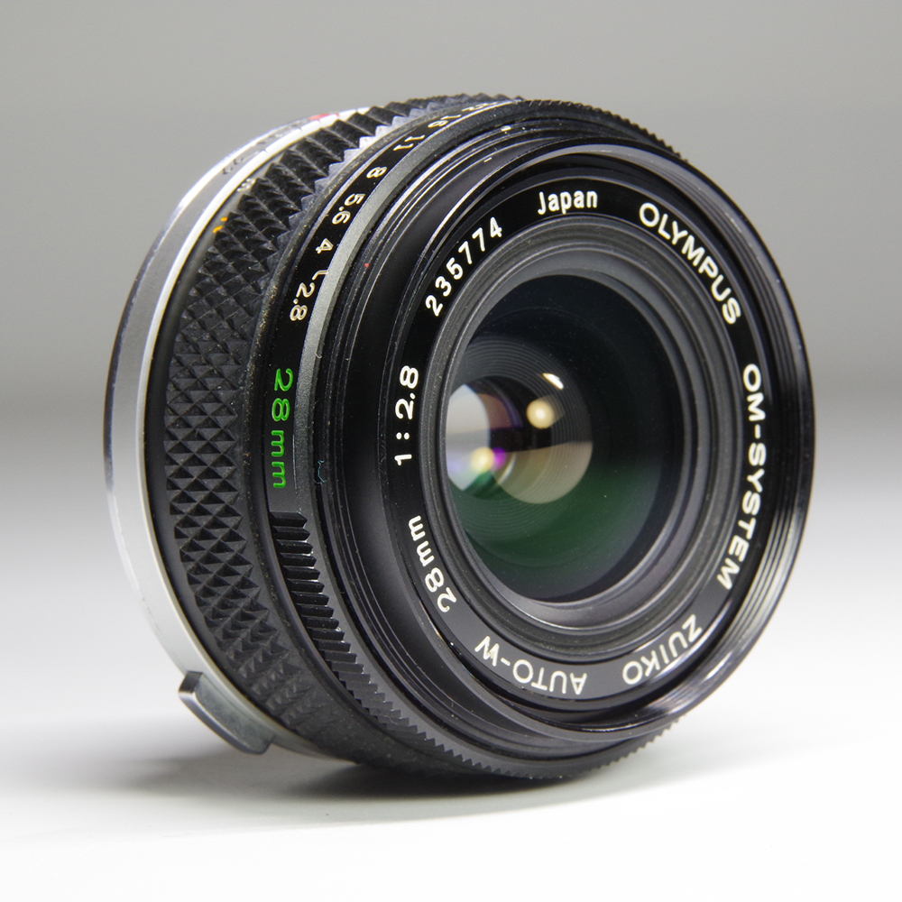 オリンパス　フィルムカメラレンズ　OM-SYSTEM ZUIKO AUTO-W 28mm 1:2.8　581