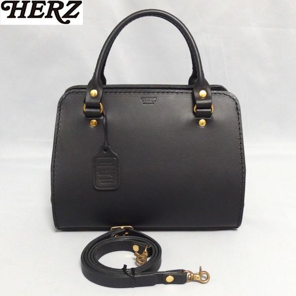 美品★HERZ チロル 2Way ショルダー ハンドバッグ 革タグ付き BE-2517 黒 ハードレザー 革と共に・Begin ロゴ ヘルツ★