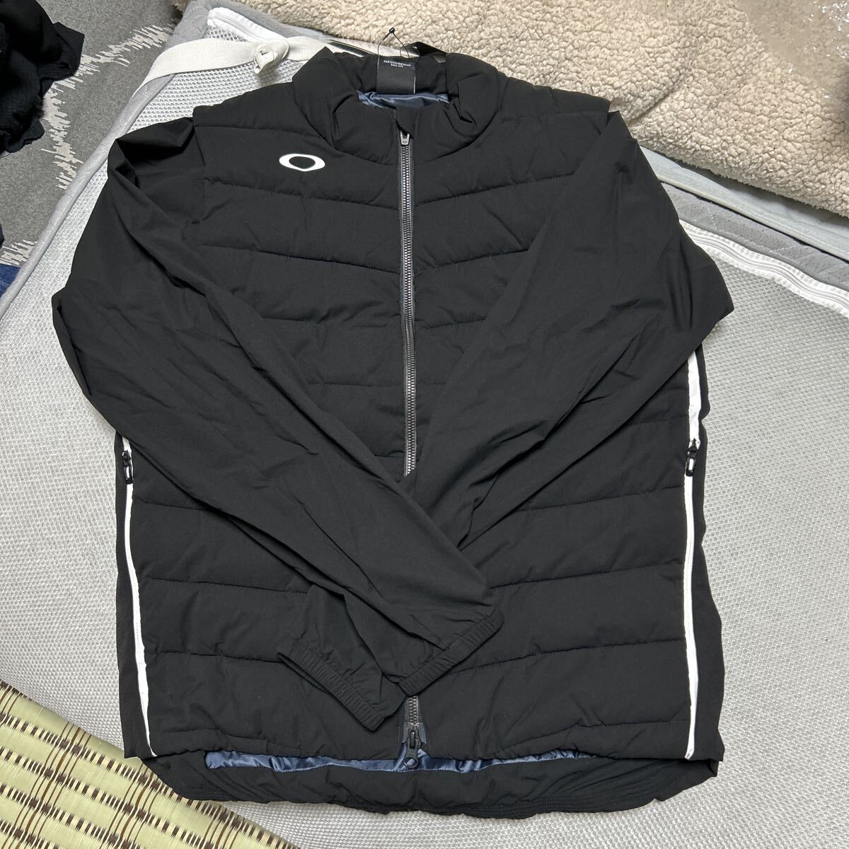 オークリー ゴルフ　スカルレディースダウンジャケットXLです OAKLEY 2WAY JACKET 黒