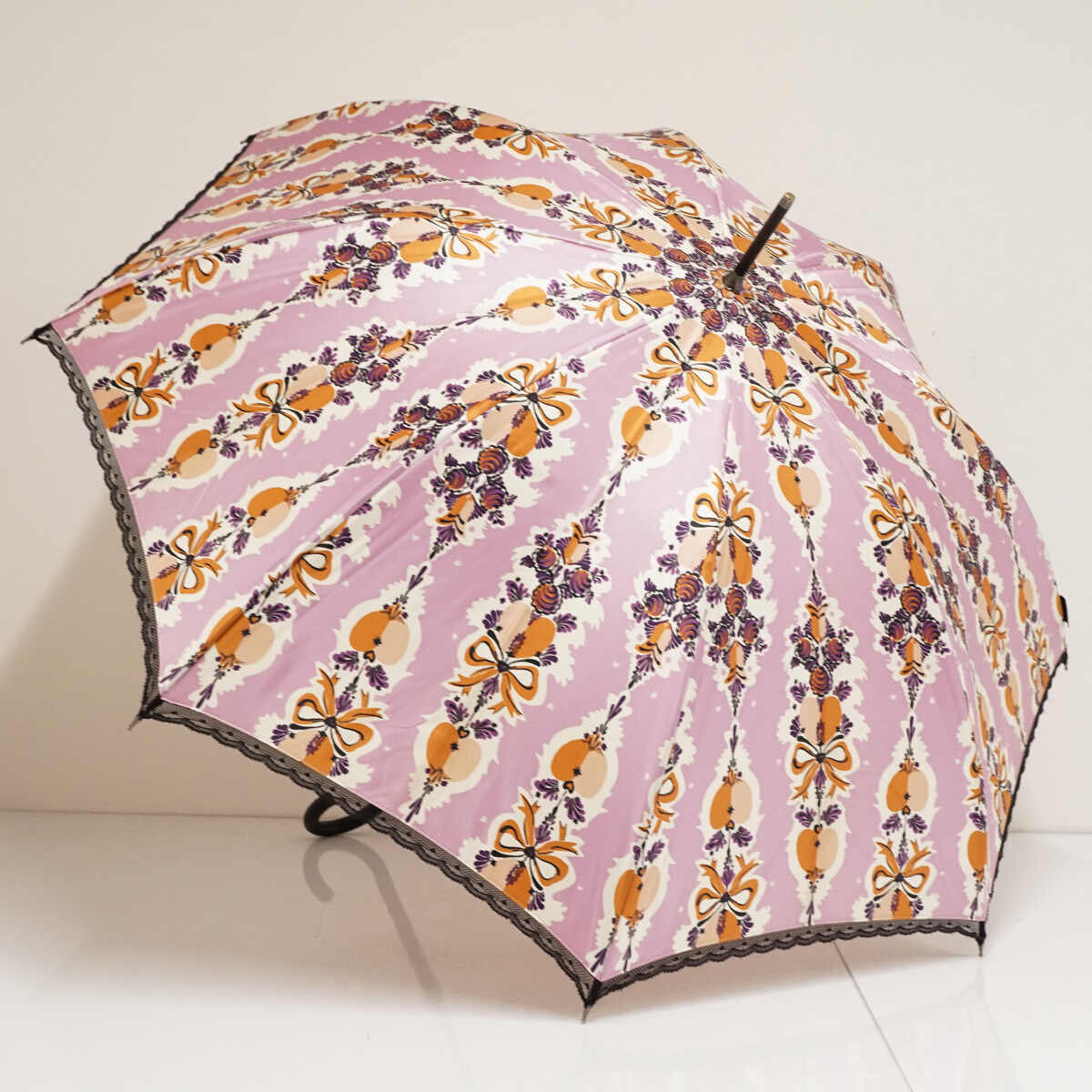 傘 ANNA SUI アナスイ USED品 リボン柄 レース縁取り ロゴ入り エレガント 個性的 グラス骨 ピンク 60cm S3308