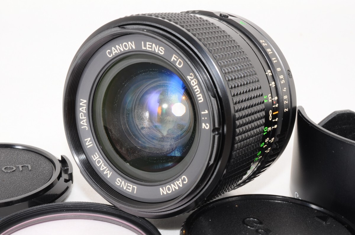 動作品 Canon キャノン レンズ New FD 28mm F2 大口径 単焦点レンズ レンズフード付 オールドレンズ キヤノン MF カメラ RR-691T/714