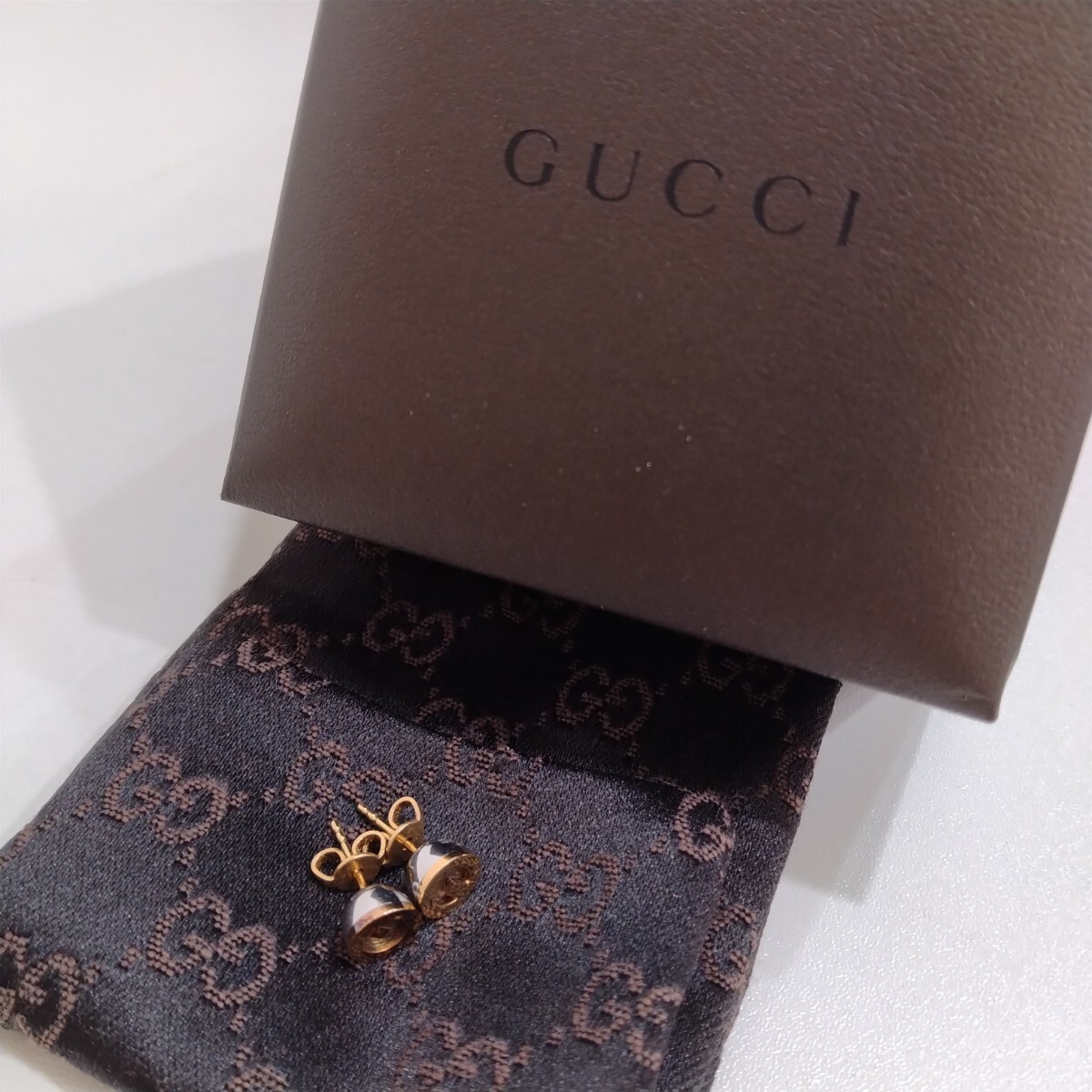 　M312002　GUCCI　グッチ　Gロゴ　ピアス　ステンレス×K18　布袋.ケース付き