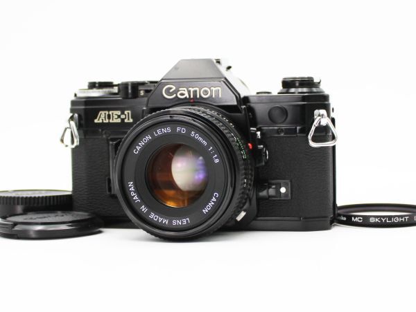54【動作品】Canon キャノン AE-1 Black ブラック 一眼レフ フィルムカメラ New FD 50mm f/1.8 NFD レンズ