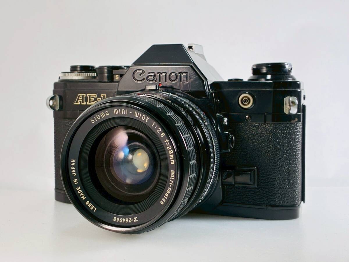 ★訳あり大特価★ キヤノン CANON AE-1 ブラック 電池室腐食なし SIGMA MINI-WIDE 28mm F2.8 動作レンズセット #S0092
