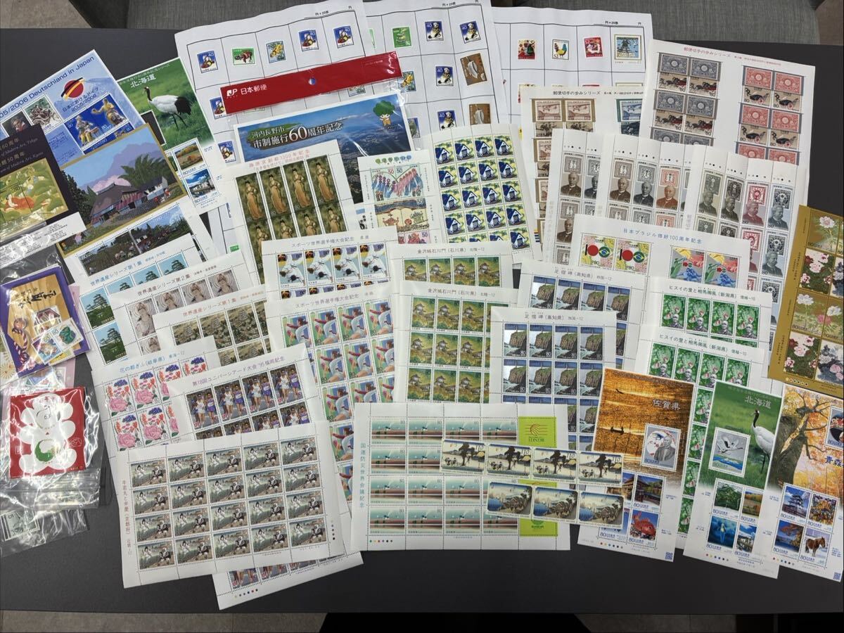 H狭【切手まとめ③】未使用 額面50,595円 大量 国際文通週間 地方自治体 世界遺産シリーズ お年玉 平成 スポーツ 郵便切手の歩み 台紙